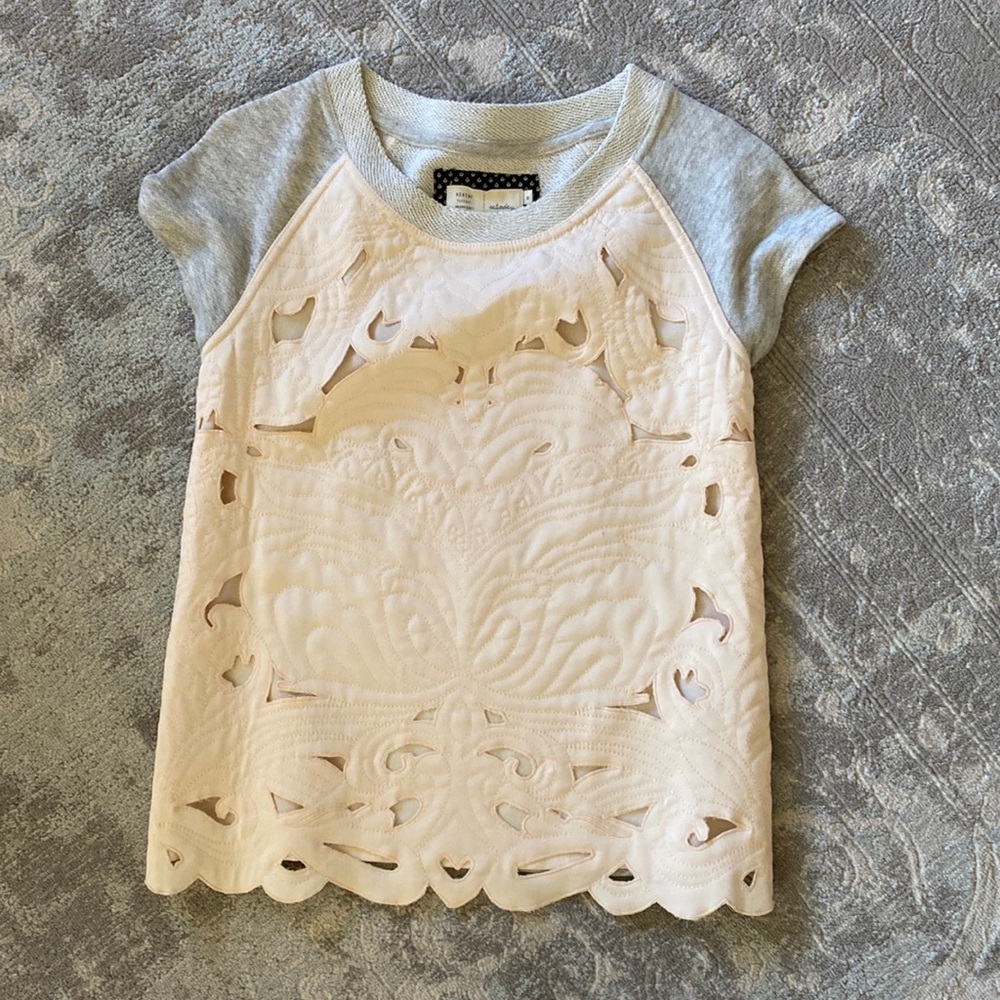 Feminine detailing on a comfy sweatshirt